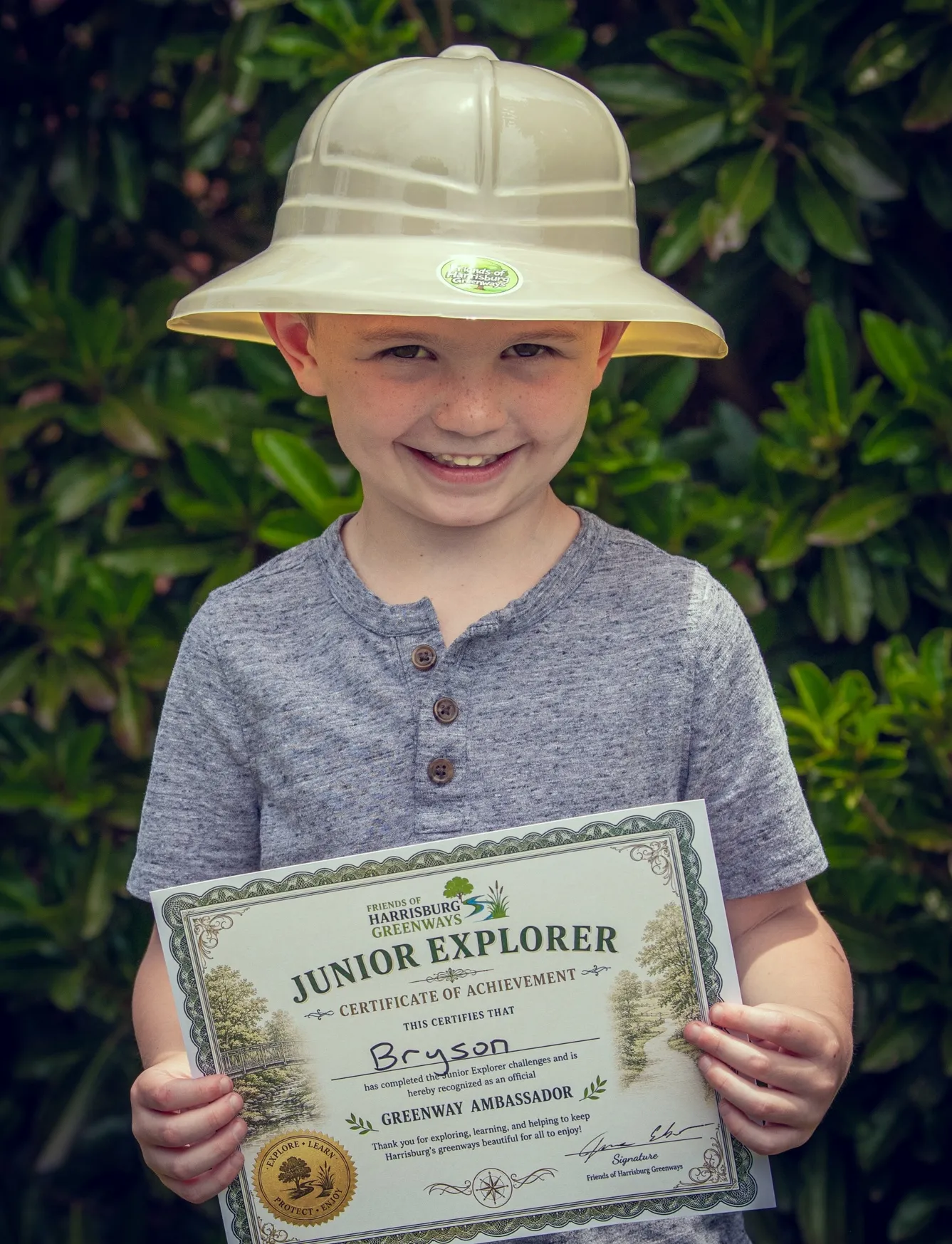 Junior Explorer with safari hat and certificate